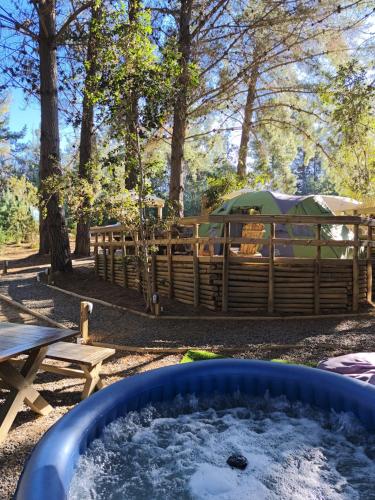 a tub of snow in front of a tent at Glamping Puertecillo Surf & Camp in Puertecillo