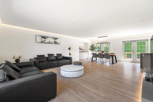 a living room with a couch and a table at Luxury&Brand-new 3BD 2BTH House in Burnaby