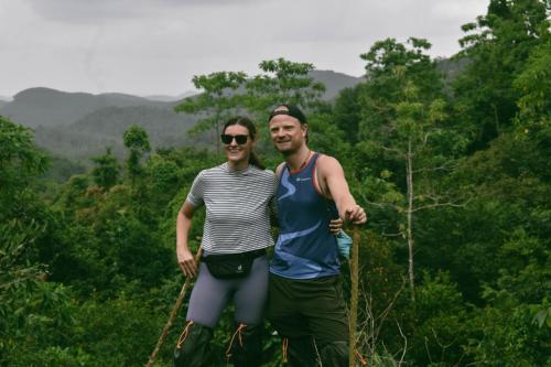 a man and a woman standing in front of a forest at AHAS GAWWA Boutique in Padukka