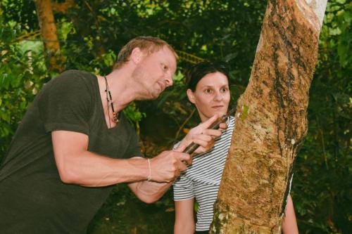 a man and a woman standing next to a tree at AHAS GAWWA Boutique in Padukka