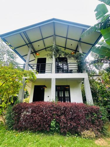 a white house with a glass roof over it at Traveller's Villa in Hatton