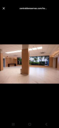 a large room with a large column in a building at Nobile Congonhas in Sao Paulo