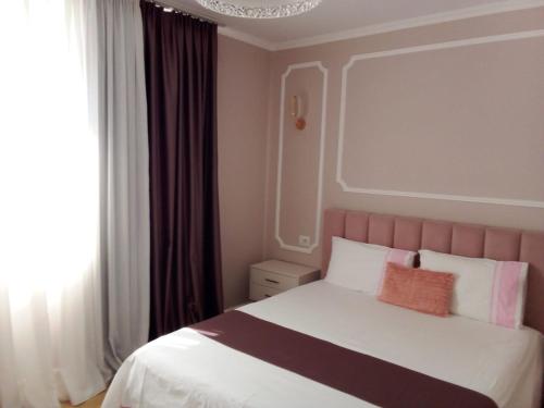 Postel nebo postele na pokoji v ubytování Vilma Apartment