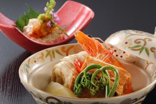 a bowl of food with sushi and a bowl of soup at Tsuganoki in Nikko