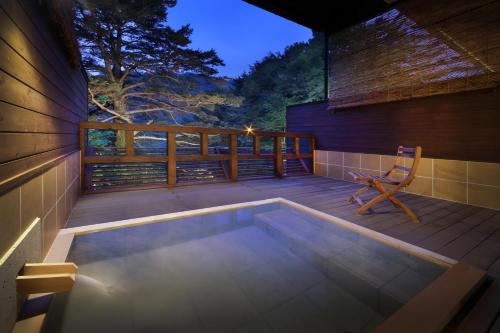 a swimming pool on the deck of a house at Tsuganoki in Nikko