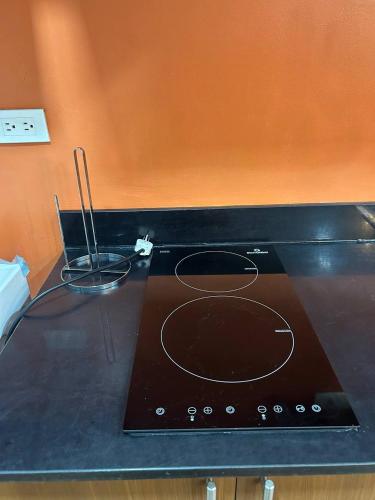 a stove top oven sitting on top of a counter at Studio and 1 Bedroom Unit at Riri's Condotel, The Loop Tower in Cagayan de Oro