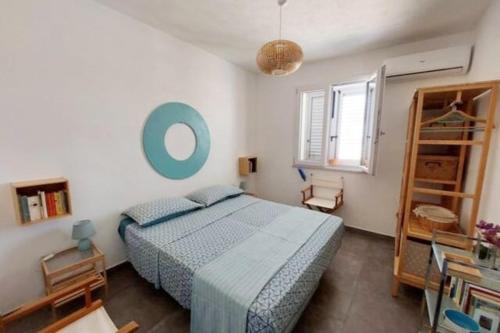 Ένα ή περισσότερα κρεβάτια σε δωμάτιο στο Casa Palombara - Healiday in Torre Salsa