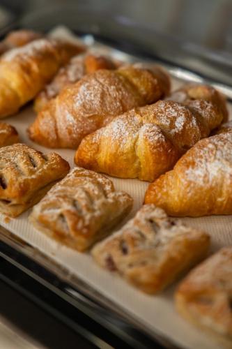 a tray filled with pastries on top at Volotel SkyWay in Cluj-Napoca