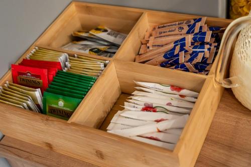 a wooden drawer filled with lots of differentiatesiatesiatesiatesktop at Volotel SkyWay in Cluj-Napoca