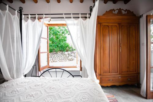 Cama ou camas em um quarto em SPITI Kathikas