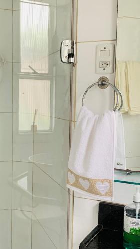a towel hanging on a towel rack in a bathroom at GUARÁS - Complete & excellent locationCOP 30 in Belém