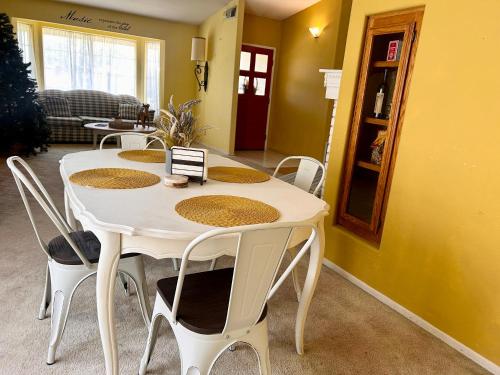 a white table and chairs in a living room at Wildflower Haven room in Hemet