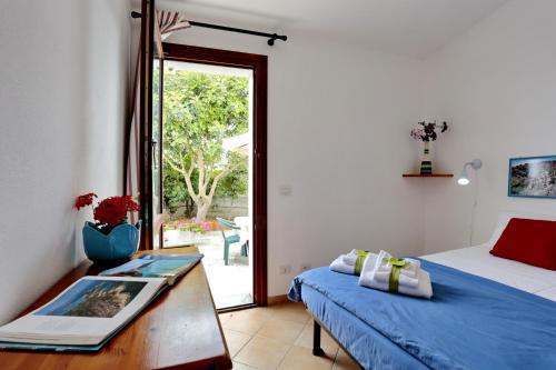 Postel nebo postele na pokoji v ubytování Il Melo Residence