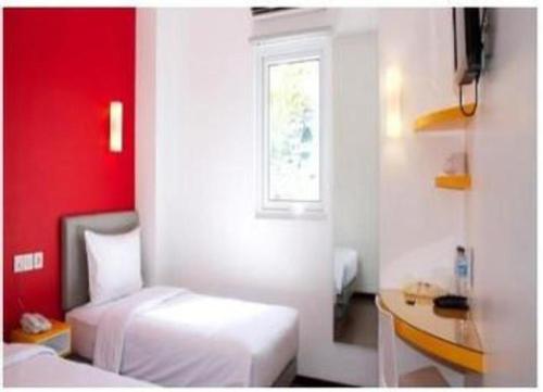 Ένα ή περισσότερα κρεβάτια σε δωμάτιο στο Amaris Hotel Ambon