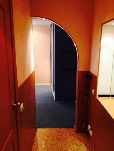 an entrance to a hallway with an open door at Apartment on Druzhby 4 in Perm