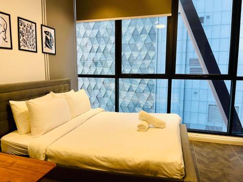 Postel nebo postele na pokoji v ubytování Ritz Residence Suites Scarletz KLCC