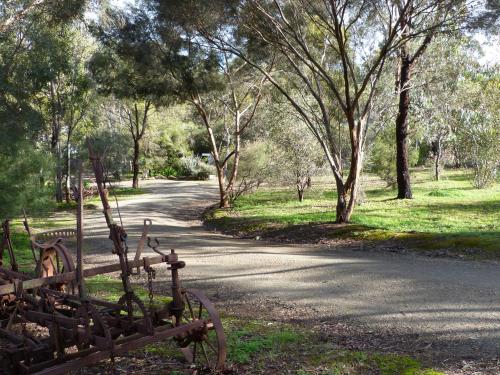 a road with a gate in the middle of a park at Watervale Retreat in Watervale