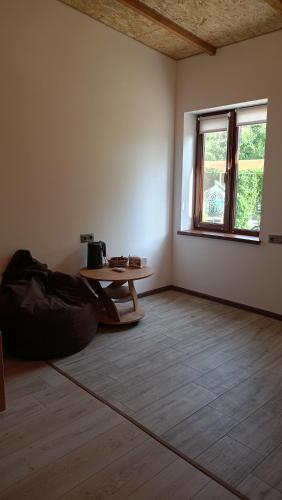 an empty room with a table and a window at Khachatryan's Guest House in Yeghegnadzor
