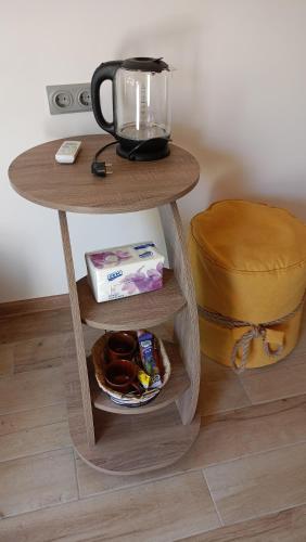 a small table with a coffee maker on top of it at Khachatryan's Guest House in Yeghegnadzor