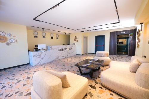 a living room with two couches and a table at CLASS PREMİUM hotel in Çanakçılar