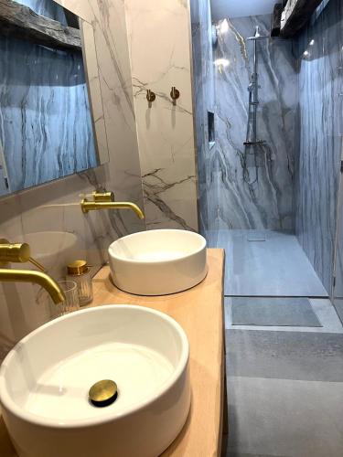 a bathroom with a sink and a toilet and a shower at L escale des dhuys in Soulaines-Dhuys