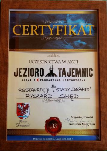 a framed diploma sign for actrination in klezmeralamalamalamalam at Stary Drahim in Czaplinek