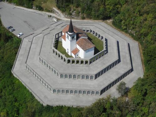 an overhead view of a church with a tower at Luxurious RUBY Apartment with SAUNA in Kobarid