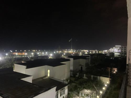 a view of a city at night with lights at Astara Guest House Marina in Astara