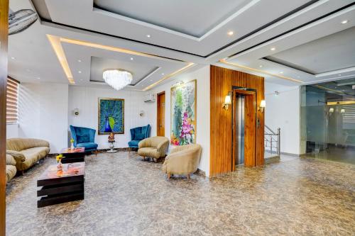 a living room with couches and a table at The Grace in Gurgaon