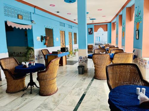 a restaurant with a row of chairs and tables at Mystic View Jodhpur in Jodhpur