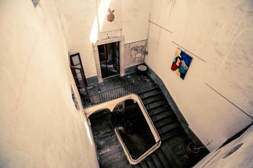 an overhead view of a staircase in a building at Hotel de L Orange in Sommières