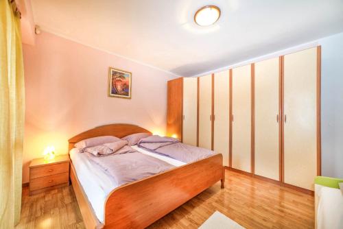 Postel nebo postele na pokoji v ubytování Apartments Cvek