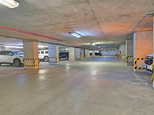 an empty parking garage with cars parked in it at Cute Condesa Studio Indoor Pool Nice Gym in Mexico City