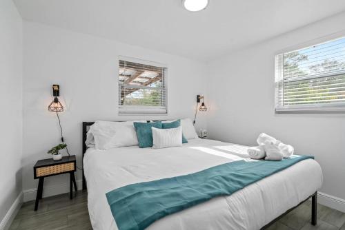 a bedroom with a bed with a teddy bear on it at The Peaceful Village Unit#3 in Plant City