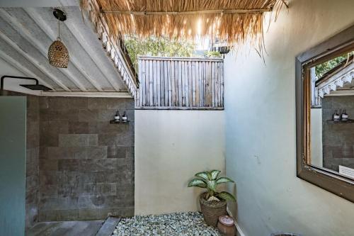 a room with a potted plant and a window at Villa La Luna 2BR Joglo Style with Pool by Damaresa in Dalung