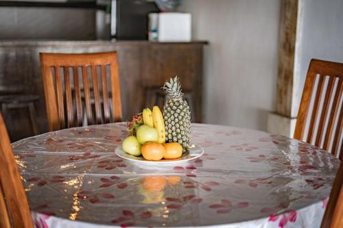 a bowl of fruit sitting on a table at Villa La Luna 2BR Joglo Style with Pool by Damaresa in Dalung