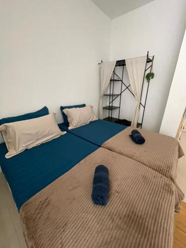 Ένα ή περισσότερα κρεβάτια σε δωμάτιο στο Rumah Inap Wancu formuslim