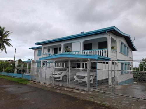 a house with a car parked in front of it at Reddy Residence in Naulu