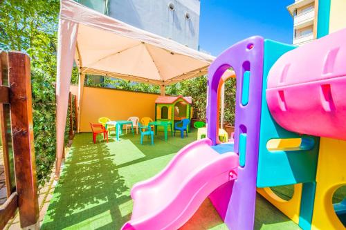 a play room with a slide and a playground at Hotel Giove dipendenza Hotel Fiamma in Cesenatico