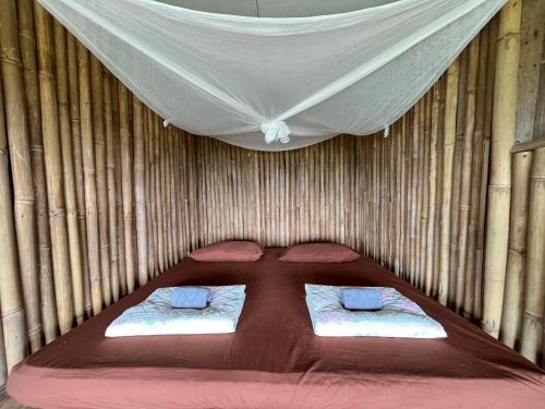 Postel nebo postele na pokoji v ubytování MonNaPaBongPiang Homestay ม่อนนาป่าบงเปียง โฮมสเตย์