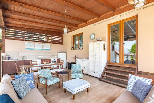 a living room with a couch and a table at Borostyán Tó Vendégház in Zalalövő