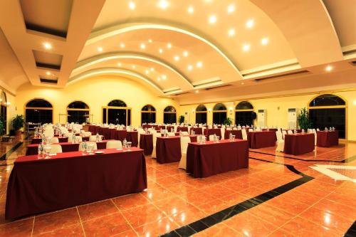 a large banquet hall with tables and chairs at Aston Niu Manokwari Hotel & Conference Center in Manokwari
