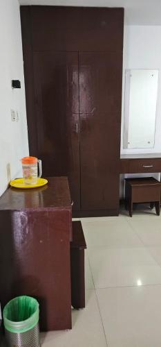 a coffee cup on a yellow plate on a table at The Green Regency Annexe in Munnar