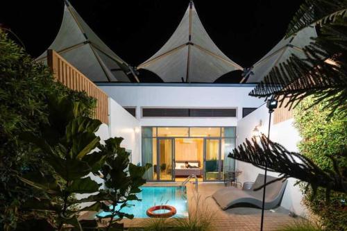 a house with a swimming pool in front of it at The X10 Nordic Tent and Glamping Pool Villa Khaoyai เขาใหญ่ - SHA Certified in Ban Thung Sawang