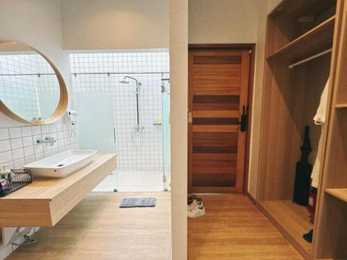 a bathroom with a shower and a sink and a mirror at The X10 Nordic Tent and Glamping Pool Villa Khaoyai เขาใหญ่ - SHA Certified in Ban Thung Sawang