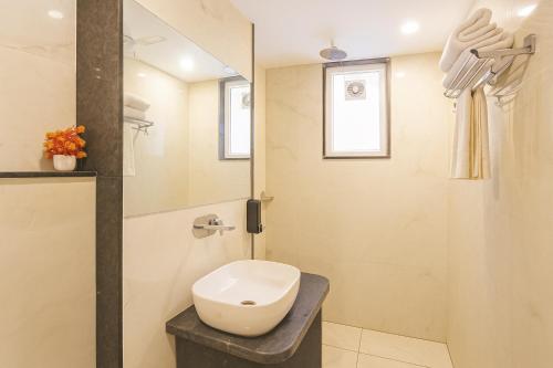 a bathroom with a toilet and a shower at Hotel Mayfair Just a Minute Away From New Delhi Railway Station and Connaught place in New Delhi