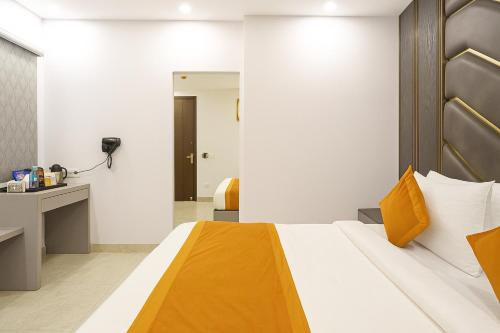 a hotel room with a bed and a desk at Hotel Mayfair Just a Minute Away From New Delhi Railway Station and Connaught place in New Delhi