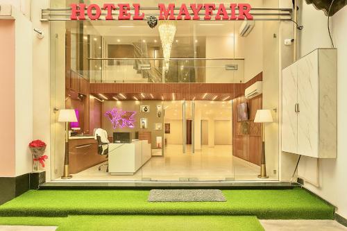 a view of a hotel lobby with a green floor at Hotel Mayfair Just a Minute Away From New Delhi Railway Station and Connaught place in New Delhi