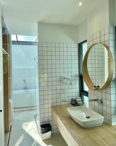 a bathroom with a sink and a mirror and a tub at The X10 Nordic Tent and Glamping Pool Villa Khaoyai เขาใหญ่ - SHA Certified in Ban Thung Sawang
