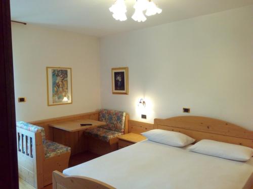 Postel nebo postele na pokoji v ubytování B&B Casa Bazzanella